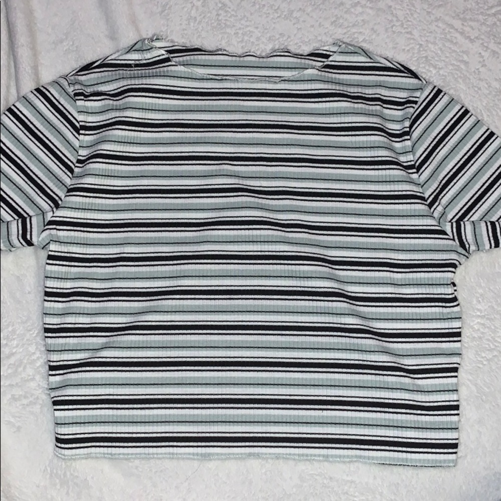 A black, green, and white striped shirt